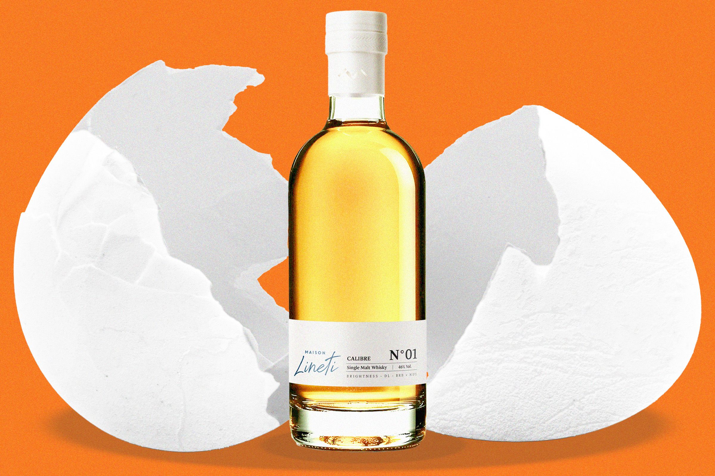 A stylish bottle of Maison Lineti whisky on a bar counter.